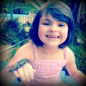 Charlie holding a cicada.